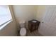 Compact powder room with a vanity and toilet at 2031 Warrens Ave, Maitland, FL 32751