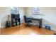 Bright bedroom with hardwood floors, a desk and a large window at 2272 Raeford Rd # A-3, Orlando, FL 32806