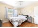 Bright bedroom with hardwood floors, soft lighting and comfortable furnishings at 2272 Raeford Rd # A-3, Orlando, FL 32806