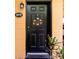 Close-up of front door, featuring welcome decor and the house number at 2272 Raeford Rd # A-3, Orlando, FL 32806