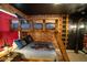 The bedroom features brick walls, Harry Potter themed decor, and custom wooden bunk beds with ambient lighting at 2379 Distant Sun Trl, Kissimmee, FL 34747