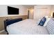 Comfortable bedroom featuring a plush bed, ample closet space, and stylish accents at 2379 Distant Sun Trl, Kissimmee, FL 34747