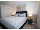 Inviting bedroom featuring a plush bed, closet, and stylish decor at 2379 Distant Sun Trl, Kissimmee, FL 34747