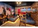 This Harry Potter-themed bedroom has bunkbeds, brick walls, and Hogwarts decor for an immersive experience at 2379 Distant Sun Trl, Kissimmee, FL 34747