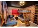 This Harry Potter-themed bedroom has bunkbeds, brick walls, and Hogwarts decor for an immersive experience at 2379 Distant Sun Trl, Kissimmee, FL 34747