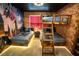 The bedroom features brick walls, Harry Potter themed decor, and custom wooden bunk beds with ambient lighting at 2379 Distant Sun Trl, Kissimmee, FL 34747
