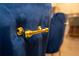 Close-up of blue velvet chair with gold accents, showcasing luxurious details at 2379 Distant Sun Trl, Kissimmee, FL 34747