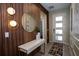 Charming foyer with stylish lighting, designer mirror, and modern console table at 2379 Distant Sun Trl, Kissimmee, FL 34747