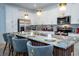 Beautiful kitchen with granite countertops, stainless steel appliances, and ample seating at the island at 2379 Distant Sun Trl, Kissimmee, FL 34747