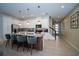Modern kitchen with granite countertops, stainless steel appliances, and a stylish island with seating at 2379 Distant Sun Trl, Kissimmee, FL 34747