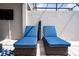 Inviting patio area with lounge chairs, perfect for relaxation and soaking up the sun at 2379 Distant Sun Trl, Kissimmee, FL 34747