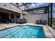 Refreshing pool area with comfortable seating and a screened enclosure for outdoor enjoyment at 2379 Distant Sun Trl, Kissimmee, FL 34747
