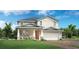 Charming two-story home featuring a well-maintained lawn, front porch and an attached two-car garage at 2521 Cedar Rose St, Apopka, FL 32712