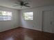 Bedroom with wood floors and lots of light from the windows at 2632 Derbyshire Rd, Maitland, FL 32751