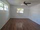 Bright bedroom with hardwood floors and windows providing natural light at 2632 Derbyshire Rd, Maitland, FL 32751