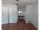 Bedroom featuring hardwood floors and a vanity area at 2632 Derbyshire Rd, Maitland, FL 32751