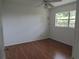 Bright bedroom with a window, ceiling fan, and wood floors at 2632 Derbyshire Rd, Maitland, FL 32751