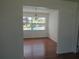 Bright dining room with chandelier and a view of the backyard pool at 2632 Derbyshire Rd, Maitland, FL 32751