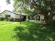 Charming single-story home with well-maintained lawn and mature trees at 2632 Derbyshire Rd, Maitland, FL 32751