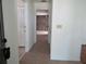 Hallway featuring tile floor leading to kitchen and other rooms at 2632 Derbyshire Rd, Maitland, FL 32751