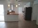 Well-lit kitchen with stainless steel refrigerator and wood countertops at 2632 Derbyshire Rd, Maitland, FL 32751