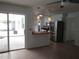 Open kitchen layout with stainless steel appliances and breakfast bar at 2632 Derbyshire Rd, Maitland, FL 32751