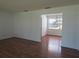 Spacious room with hardwood floors offers ample natural light at 2632 Derbyshire Rd, Maitland, FL 32751