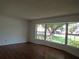 Inviting living room featuring a bay window and hardwood floors at 2632 Derbyshire Rd, Maitland, FL 32751