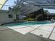 This enclosed pool offers a refreshing space for relaxation and enjoyment, complemented by a spacious patio at 2632 Derbyshire Rd, Maitland, FL 32751