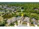 Aerial view showcases the property's location within a community with nearby amenities and pond at 2652 Bent Hickory Cir, Longwood, FL 32779