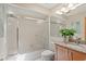 Well-lit bathroom features a shower-tub combo, granite countertop and modern fixtures at 2652 Bent Hickory Cir, Longwood, FL 32779