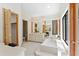 Luxurious bathroom with a soaking tub, vanity and large window, creating a spa-like experience at 2652 Bent Hickory Cir, Longwood, FL 32779