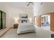 Spacious bedroom with large windows, providing ample natural light, complemented by tasteful decor at 2652 Bent Hickory Cir, Longwood, FL 32779