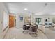 Bright dining area with tile floors, an open view to the kitchen, and access to the living room at 2652 Bent Hickory Cir, Longwood, FL 32779