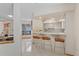 Open-concept kitchen with breakfast bar, featuring modern appliances and tile flooring, perfect for entertaining at 2652 Bent Hickory Cir, Longwood, FL 32779