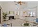 Spacious living area featuring a fireplace, high ceilings, and seamless access to other living spaces at 2652 Bent Hickory Cir, Longwood, FL 32779