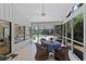 Enjoy the screened patio with tile flooring, ceiling fan, and tranquil views of the pool at 2652 Bent Hickory Cir, Longwood, FL 32779