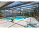 Stunning screened-in pool area with comfortable lounge chairs is perfect for relaxation at 2652 Bent Hickory Cir, Longwood, FL 32779