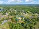 Aerial view shows property lines around a home surrounded by lush greenery and trees at 2659 Hibbard Trl, Chuluota, FL 32766