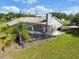 Beautiful backyard featuring a screened-in pool and well-maintained landscaping at 2659 Hibbard Trl, Chuluota, FL 32766