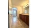 Bathroom with a double vanity and door leading to the tiled shower at 2659 Hibbard Trl, Chuluota, FL 32766