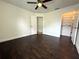 Bedroom with dark wood floors and walk-in closet at 2659 Hibbard Trl, Chuluota, FL 32766