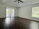 Bedroom with backyard views and wood laminate flooring at 2659 Hibbard Trl, Chuluota, FL 32766