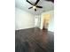 A bright and airy bedroom boasts dark wood floors and a walk-in closet at 2659 Hibbard Trl, Chuluota, FL 32766