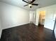 Spacious bedroom with ceiling fan, wood floors, and walk in closet at 2659 Hibbard Trl, Chuluota, FL 32766