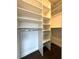 Walk-in closet featuring custom shelving and wire storage baskets at 2659 Hibbard Trl, Chuluota, FL 32766