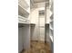 Walk-in closet featuring custom shelving and closet rods at 2659 Hibbard Trl, Chuluota, FL 32766