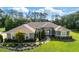 Charming single-story home featuring lush landscaping, verdant lawn, and a welcoming front entrance at 2659 Hibbard Trl, Chuluota, FL 32766