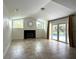 Living room featuring a fireplace, windows, tile flooring, and access to the pool at 2659 Hibbard Trl, Chuluota, FL 32766
