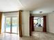Open living area with tile flooring, access to pool, and natural light at 2659 Hibbard Trl, Chuluota, FL 32766